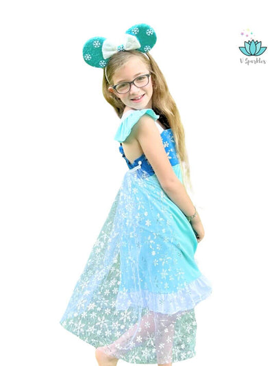Elsa Frozen Disneybound Costume for Kids: A whimsical Elsa-inspired dress with a sparkling cape, designed for Disneybounding, Halloween, and birthday parties. This outfit makes a fantastic self treat or gift for little ice queens who love to dress to impress.
