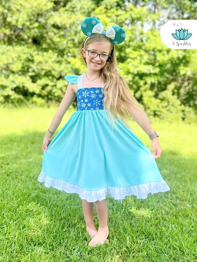 Frozen-Themed Elsa Disneybound Outfit with Cape: A charming Elsa-inspired dress featuring a snowflake-printed cape, perfect for Disneybounding or as a Halloween costume. This magical outfit is great for kids who enjoy imaginative play pretend and dress-up games.