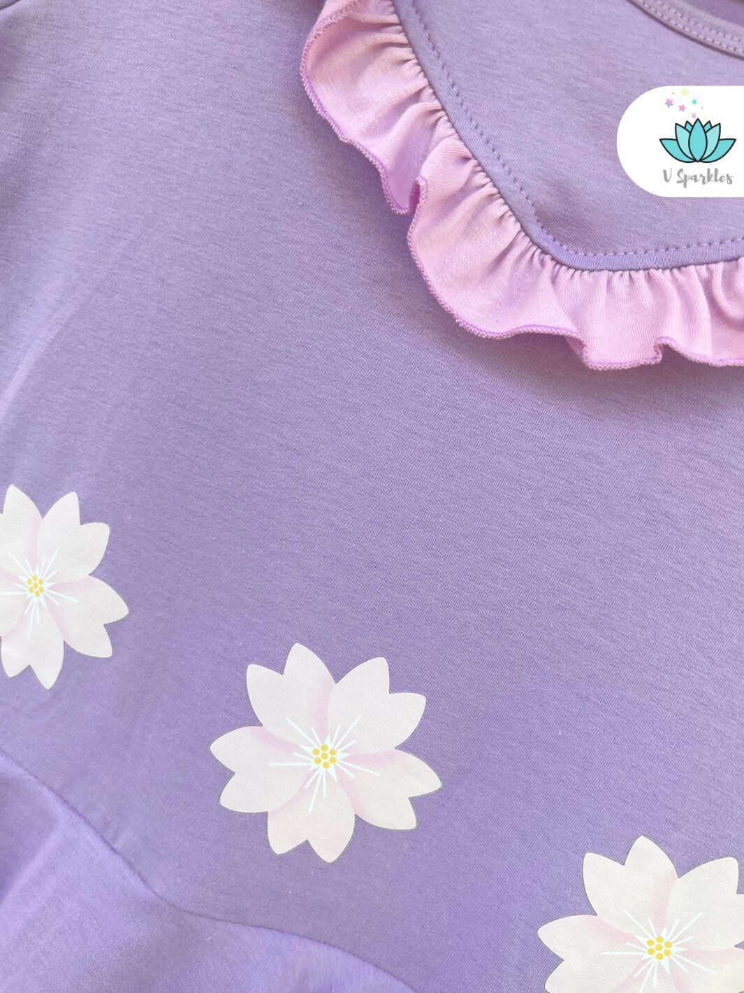 Isabela Encanto Dress for Adults: A detailed view of the floral embellishments on this purple Isabela-inspired dress, designed for Disneybounding, dress-up games, or as a stylish self-treat. Great for expressing your inner Encanto character at parties or special events.