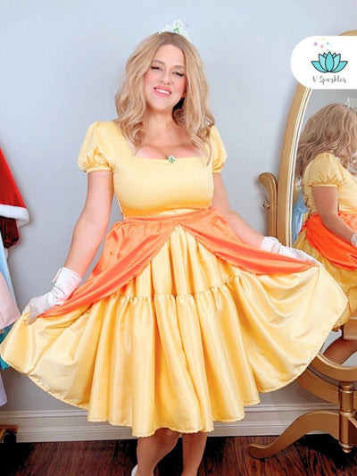 Yellow Princess Video Game Dress-Up Overskirt for Women – Ideal for Disneybounding and Special Events – This Princess Peach-inspired yellow overskirt is perfect for adults looking to create a fun and magical look for Disneybounding or themed events. Available in mid-size and plus-size options.