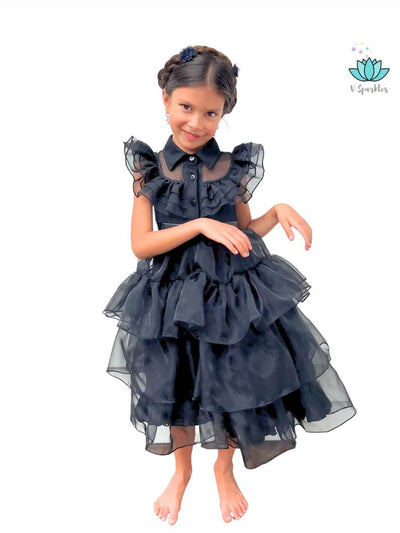 Black ruffled Wednesday Addams kids' dress, great for Halloween parties or Disneybound events. Ideal for kids who love to play pretend and dress up as spooky characters.